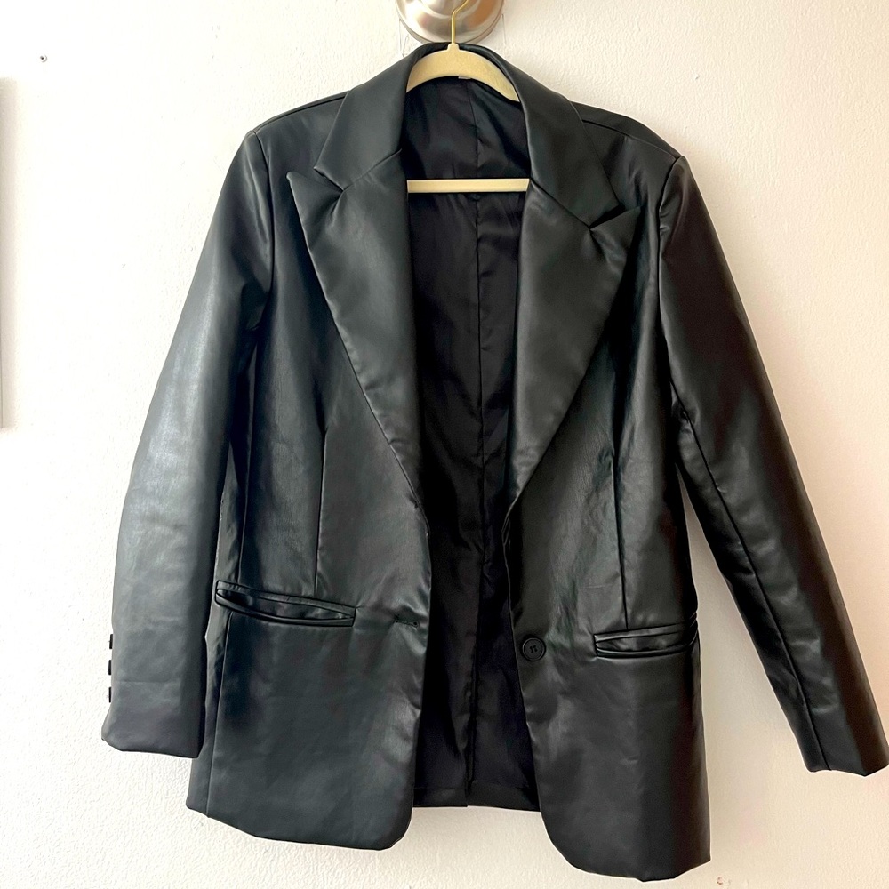 Black leather blazer fits small and medium